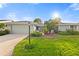 Charming single-story home features a well-manicured lawn and a two-car garage at 1306 Idlewood Dr # 53, Sun City Center, FL 33573
