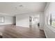 Spacious living room with wood floors and a seamless flow into the kitchen area at 1306 Idlewood Dr # 53, Sun City Center, FL 33573