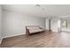 Bright and open living area with wood floors and access to other rooms at 1306 Idlewood Dr # 53, Sun City Center, FL 33573