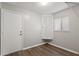 Small room with a door, window with blind, and storage cabinet at 1306 Idlewood Dr # 53, Sun City Center, FL 33573
