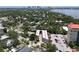 Overhead view of the property surrounded by lush greenery and the city skyline in the background at 1508 S Howard Ave # A, Tampa, FL 33606