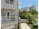 Private balcony with seating area and views of the surrounding trees and city skyline at 1508 S Howard Ave # A, Tampa, FL 33606