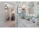 Stylish bathroom with white marble vanity, custom wallpaper, and contemporary fixtures at 1508 S Howard Ave # A, Tampa, FL 33606