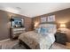 Comfortable bedroom with neutral tones, soft lighting, and a decorative chest of drawers at 1508 S Howard Ave # A, Tampa, FL 33606