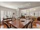 Open-concept dining room featuring hardwood floors, elegant furnishings, and natural light at 1508 S Howard Ave # A, Tampa, FL 33606