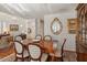 Formal dining room with hardwood floors, elegant furnishings, and natural light at 1508 S Howard Ave # A, Tampa, FL 33606