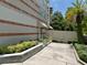 Beautifully landscaped entry to building with lush tropical plants and an attractive architectural design at 1508 S Howard Ave # A, Tampa, FL 33606