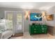 Bright living room featuring a decorative green dresser and access to the outdoors at 1508 S Howard Ave # A, Tampa, FL 33606