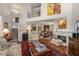 Bright living room features an open floor plan, fireplace, and staircase leading to the second level at 1508 S Howard Ave # A, Tampa, FL 33606