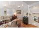 Inviting living area showcasing hardwood floors, tall ceilings, and lots of natural light at 1508 S Howard Ave # A, Tampa, FL 33606