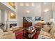 Spacious living room with a cozy fireplace, vaulted ceilings, and ample natural light at 1508 S Howard Ave # A, Tampa, FL 33606