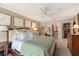 Relaxing main bedroom features an ensuite bathroom and a large bed with green accents at 1508 S Howard Ave # A, Tampa, FL 33606