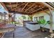 Inviting back deck area with a hot tub and stylish pergola, perfect for outdoor relaxation at 1530 Erin Ln, Clearwater, FL 33755