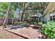 Spacious backyard showcasing the deck, pergola, and inviting outdoor space at 1530 Erin Ln, Clearwater, FL 33755