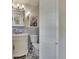 The bathroom includes an ornate vanity and decorative tiles at 1530 Erin Ln, Clearwater, FL 33755