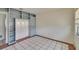 Bedroom with tile floors, neutral walls, window, and built in shelving at 1530 Erin Ln, Clearwater, FL 33755