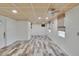 Expansive bonus room with wood-style flooring and multiple windows, offering ample natural light at 1530 Erin Ln, Clearwater, FL 33755