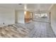 Open-concept living area with a mix of flooring styles, perfect for entertaining and relaxation at 1530 Erin Ln, Clearwater, FL 33755