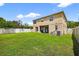 A spacious backyard provides an oasis for relaxation and play; with a patio area and lush lawn at 19028 Narimore Dr, Land O Lakes, FL 34638