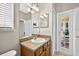 Bathroom features a vanity with neutral cabinets, tile flooring, and a walk out door to the exterior at 19028 Narimore Dr, Land O Lakes, FL 34638