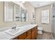 Bathroom featuring double mirrors, vanity, and walk-in shower at 19028 Narimore Dr, Land O Lakes, FL 34638