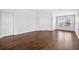 Spacious bedroom with hardwood floors and a large window at 19028 Narimore Dr, Land O Lakes, FL 34638