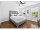 Stylish bedroom features a luxurious headboard and hardwood floors at 19028 Narimore Dr, Land O Lakes, FL 34638
