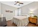 Comfortable bedroom with neutral decor, ceiling fan, and hardwood floors at 19028 Narimore Dr, Land O Lakes, FL 34638