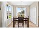 Dining area with a wooden table, lots of natural light, and views of the backyard at 19028 Narimore Dr, Land O Lakes, FL 34638