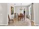 Bright dining room with neutral-colored walls, tile floors and wooden furniture set at 19028 Narimore Dr, Land O Lakes, FL 34638