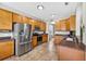 Bright kitchen featuring stainless steel appliances, wood cabinets, and tile flooring at 19028 Narimore Dr, Land O Lakes, FL 34638