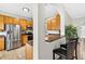Kitchen boasts stainless steel appliances, wood cabinets, and an open layout at 19028 Narimore Dr, Land O Lakes, FL 34638