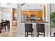 Kitchen view features wood cabinets, stainless steel appliances, and breakfast bar with seating at 19028 Narimore Dr, Land O Lakes, FL 34638