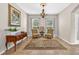 Cozy living room with two chairs, a rug, neutral walls and two windows that provide natural light at 19028 Narimore Dr, Land O Lakes, FL 34638