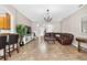 Cozy living room with tile flooring and an open layout, perfect for entertaining at 19028 Narimore Dr, Land O Lakes, FL 34638