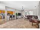 Open concept living room showcasing tile floors and an open layout to the kitchen at 19028 Narimore Dr, Land O Lakes, FL 34638