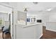 Loft with wood floors, natural lighting and neutral walls leading into another living area at 19028 Narimore Dr, Land O Lakes, FL 34638