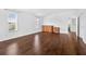 Bright main bedroom featuring wood floors and natural light from the large windows at 19028 Narimore Dr, Land O Lakes, FL 34638