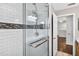 Contemporary shower with glass door and designer tile details at 19028 Narimore Dr, Land O Lakes, FL 34638