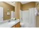 Clean bathroom featuring a tub, shower with a curtain, and a vanity with a mirror at 21248 Diamonte Dr, Land O Lakes, FL 34637