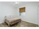 Cozy bedroom with wood floors and a window, providing a comfortable and private space at 21248 Diamonte Dr, Land O Lakes, FL 34637