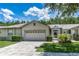 Charming single Gathering home featuring a spacious two car garage and a well-manicured lawn at 21248 Diamonte Dr, Land O Lakes, FL 34637