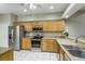 Modern kitchen featuring stainless steel appliances, light countertops and ample cabinetry at 21248 Diamonte Dr, Land O Lakes, FL 34637