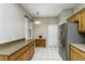 Functional kitchen with updated stainless steel appliances and ample cabinet and counter space at 21248 Diamonte Dr, Land O Lakes, FL 34637