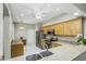 Cozy kitchen with stainless steel appliances, ample cabinet space, and bright, neutral tones at 21248 Diamonte Dr, Land O Lakes, FL 34637
