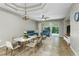 Elegant living room featuring tray ceilings, comfortable seating, and sliding glass doors to the lanai at 21248 Diamonte Dr, Land O Lakes, FL 34637