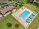 Aerial view of the community pool featuring cabanas, lounge chairs, and meticulously kept landscaping at 2131 Ridge S Rd # 19, Largo, FL 33778