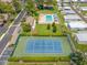 Community with a pool, cabanas, tennis court, and parking surrounded by mature trees at 2131 Ridge S Rd # 19, Largo, FL 33778