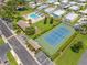 Community with a pool, cabanas, tennis court, and parking surrounded by mature trees at 2131 Ridge S Rd # 19, Largo, FL 33778