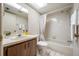 Bathroom featuring a shower and tub combo with a skylight above the single vanity sink at 2131 Ridge S Rd # 19, Largo, FL 33778